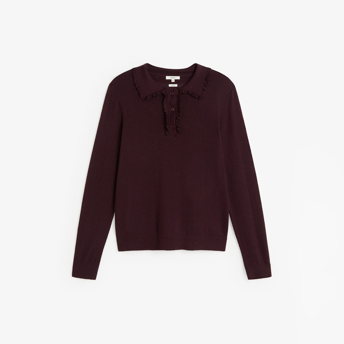 A dark plum long-sleeve knit top with a ruffled collar and a small ruffle detail at the placket, shown flat on a light gray background.