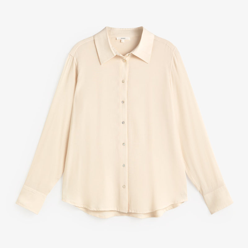 A light beige long-sleeve button-up blouse with a pointed collar and button front, displayed flat against a clean white background.