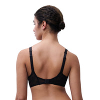 A woman shown from the back wearing a black lace bra with adjustable shoulder straps and a ruffled underband, against a plain white background.