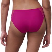 Rear view of a model wearing bright magenta pink lace-trimmed underwear against a plain white background.