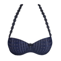 Navy blue patterned bra with decorative straps on a white background