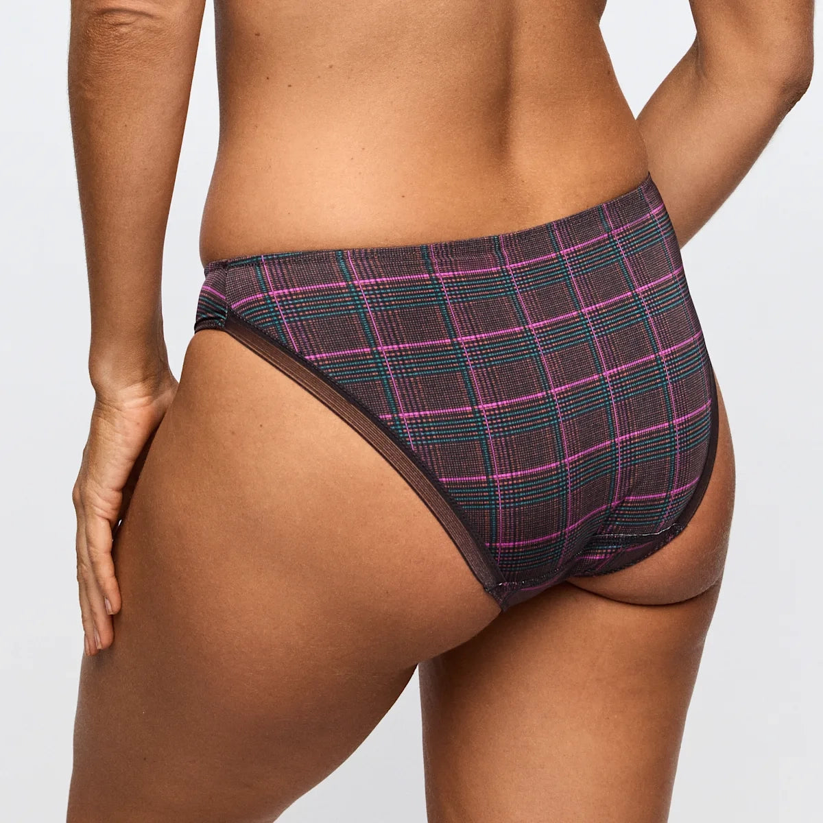 plaid patterned underwear worn by a person on a plain background