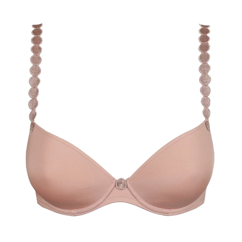 A light pink seamless underwire bra with decorative circular lace trim along the straps and a matching lace center button, shown on a plain white background.