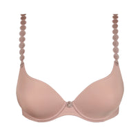 A light pink seamless underwire bra with decorative circular lace-up shoulder straps and a small rhinestone center button, shown on a plain white background.