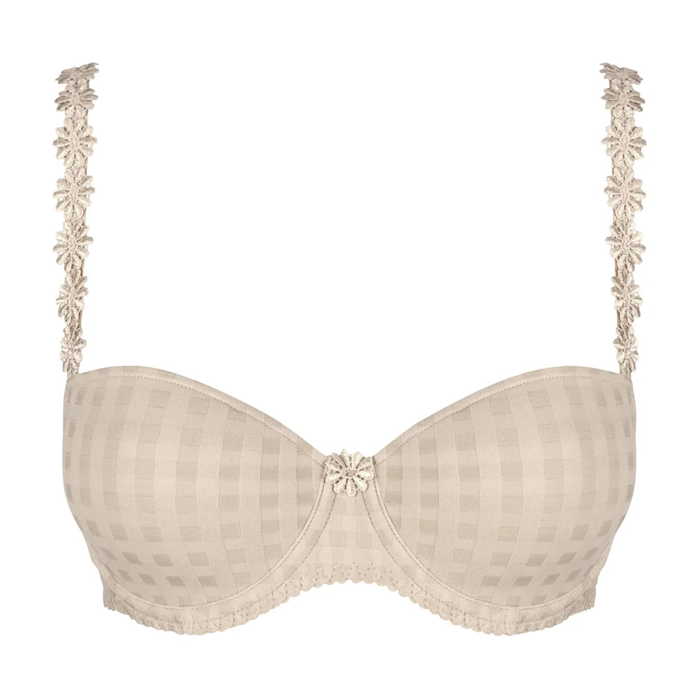beige bra with floral lace details on a white background