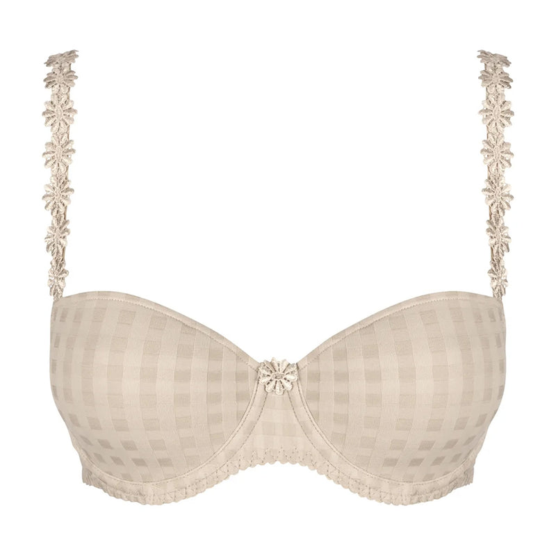 beige bra with floral lace details on a white background