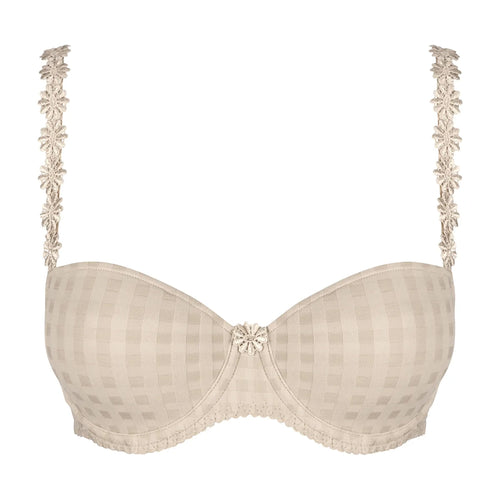 beige bra with floral lace details on a white background