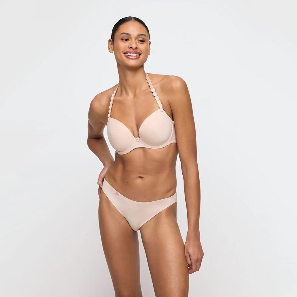 woman wearing a beige bikini on a white background