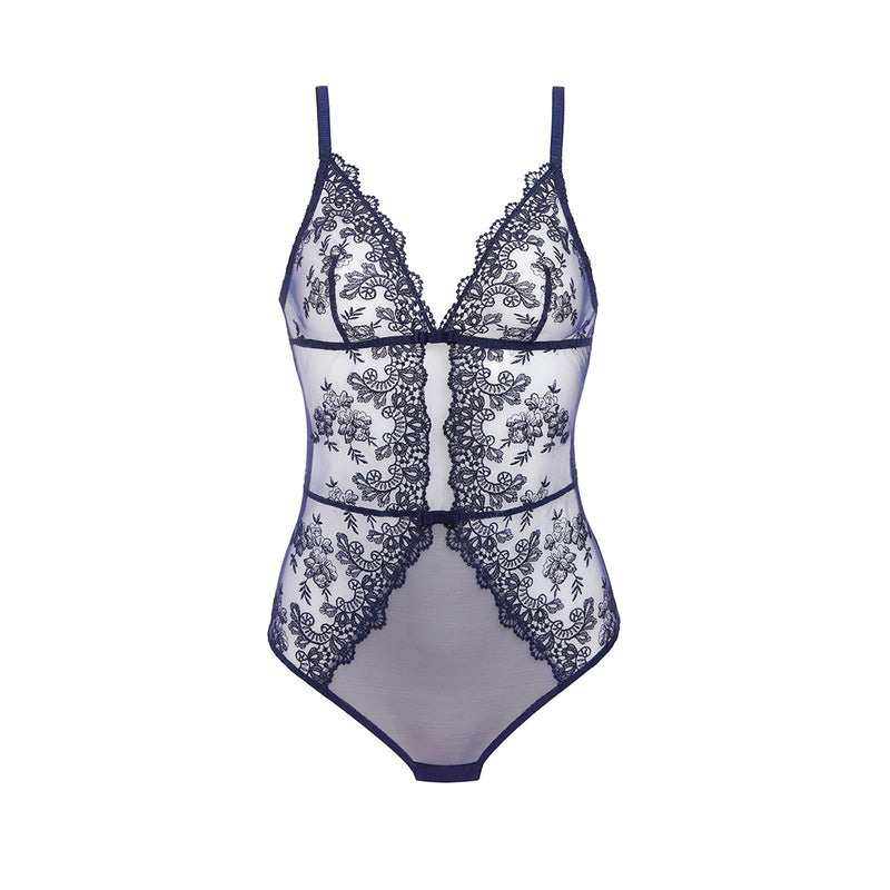A sheer white and navy blue lace bodysuit with thin straps, floral lace panels, and a center front lace overlay, shown against a plain white background.